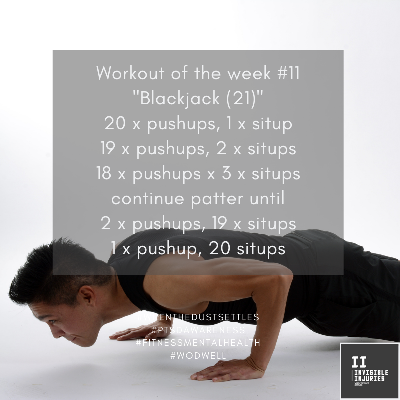 muscly asian man holding a pushup in the lowered position with workout in text