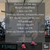 weight lifter in clean squat position with barbell overhead and workout in text
