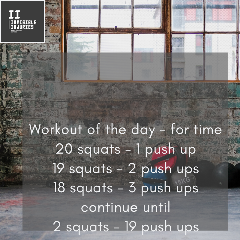 workout bag placed alongside weights on back of warehouse gym