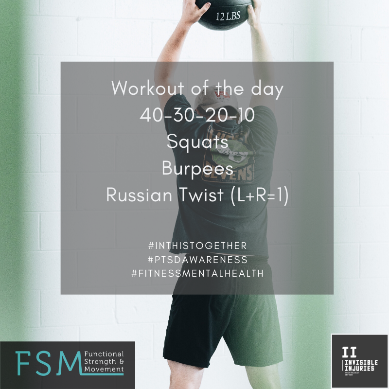 man with backward trucker cap facing wall holding a medicine ball up for ball slams