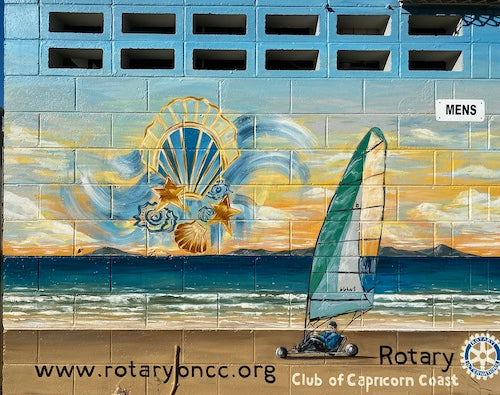 street art image of a blo-cart racing along the tidal beach flats with a windy cloud offset by a blue and yellow background.